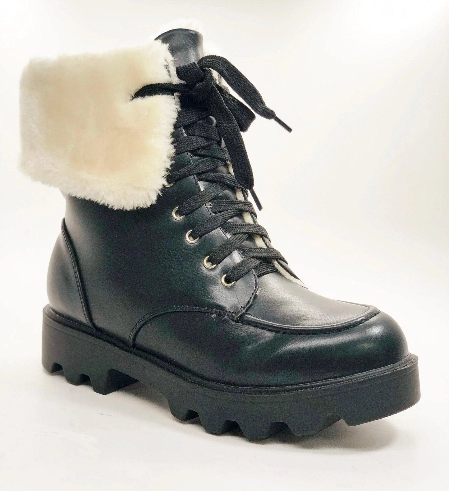 Black women's winter boot with white fur trim, lace-up design, and chunky sole for fashion and warmth
