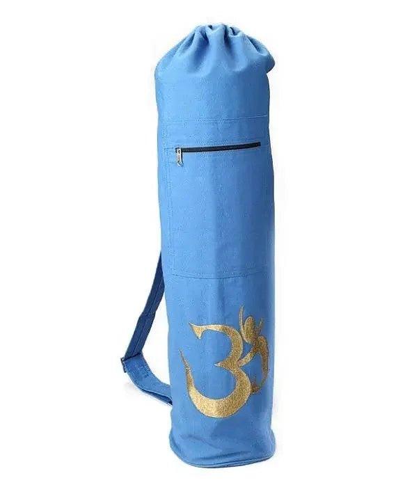 Blue yoga mat bag with gold Om symbol, drawstring closure, and shoulder strap for fitness and wellness