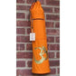 Orange yoga mat bag with gold Om symbol, hanging on brick wall, ideal for women's fitness and wellness