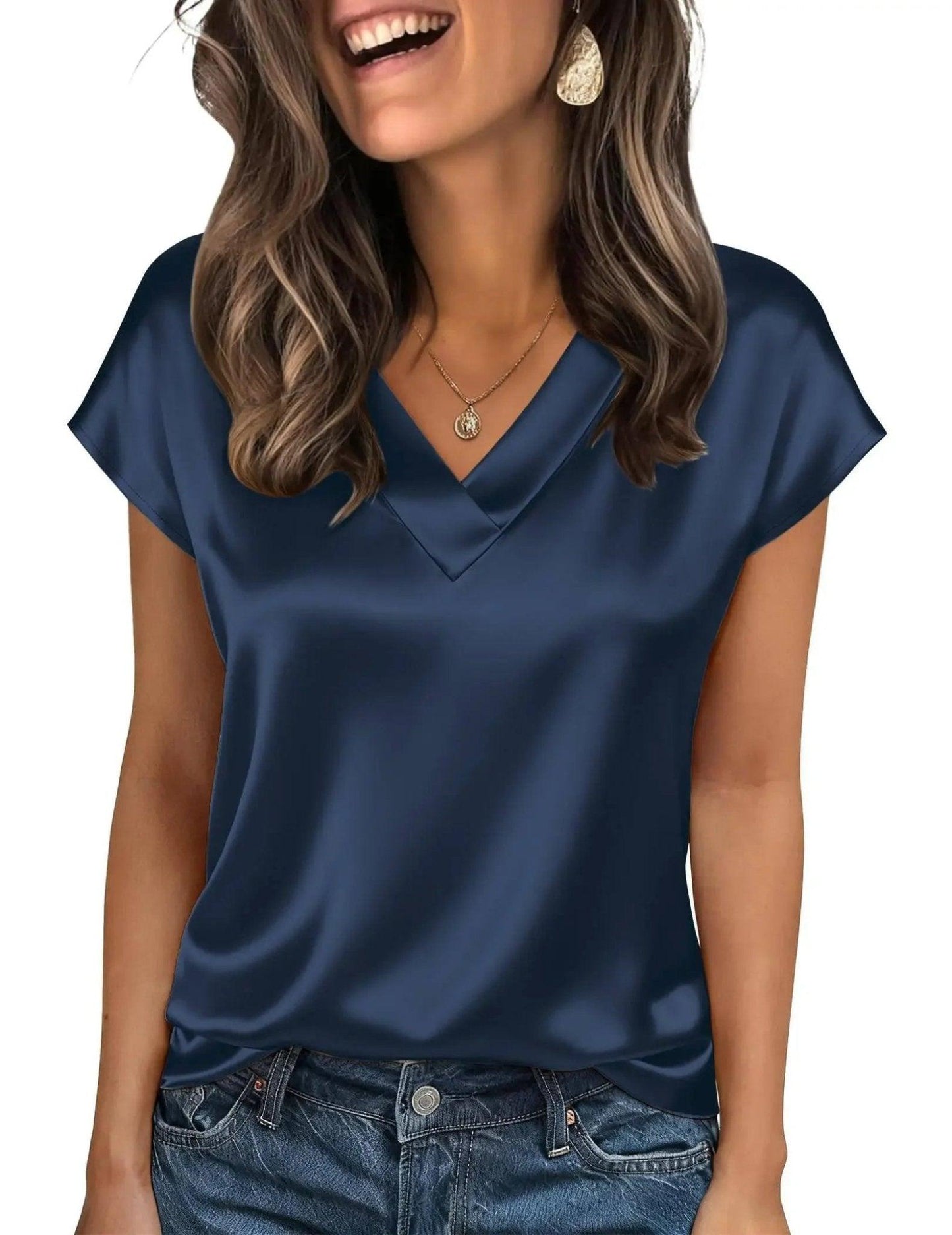 Navy blue satin V-neck women's top with short sleeves, paired with jeans and gold jewelry for casual fashion.