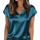 Teal satin V-neck women's blouse with short sleeves, styled with jeans and gold jewelry for casual fashion