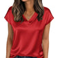 Red satin V-neck women's top with short sleeves, paired with jeans for casual fashion