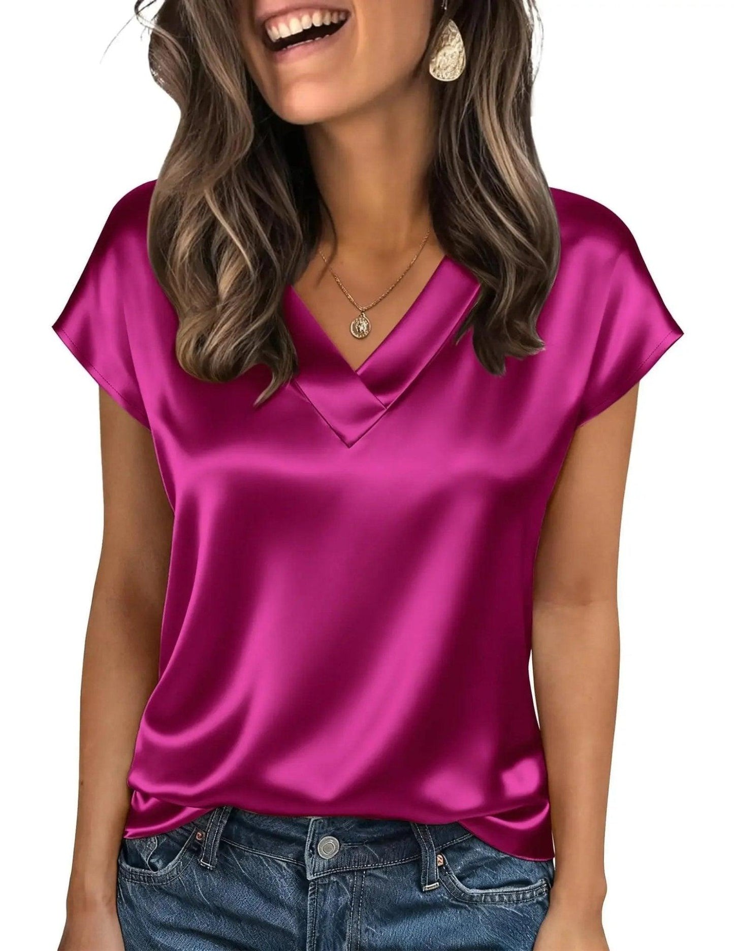 Women's shiny magenta satin V-neck top with short sleeves, paired with jeans for casual fashion