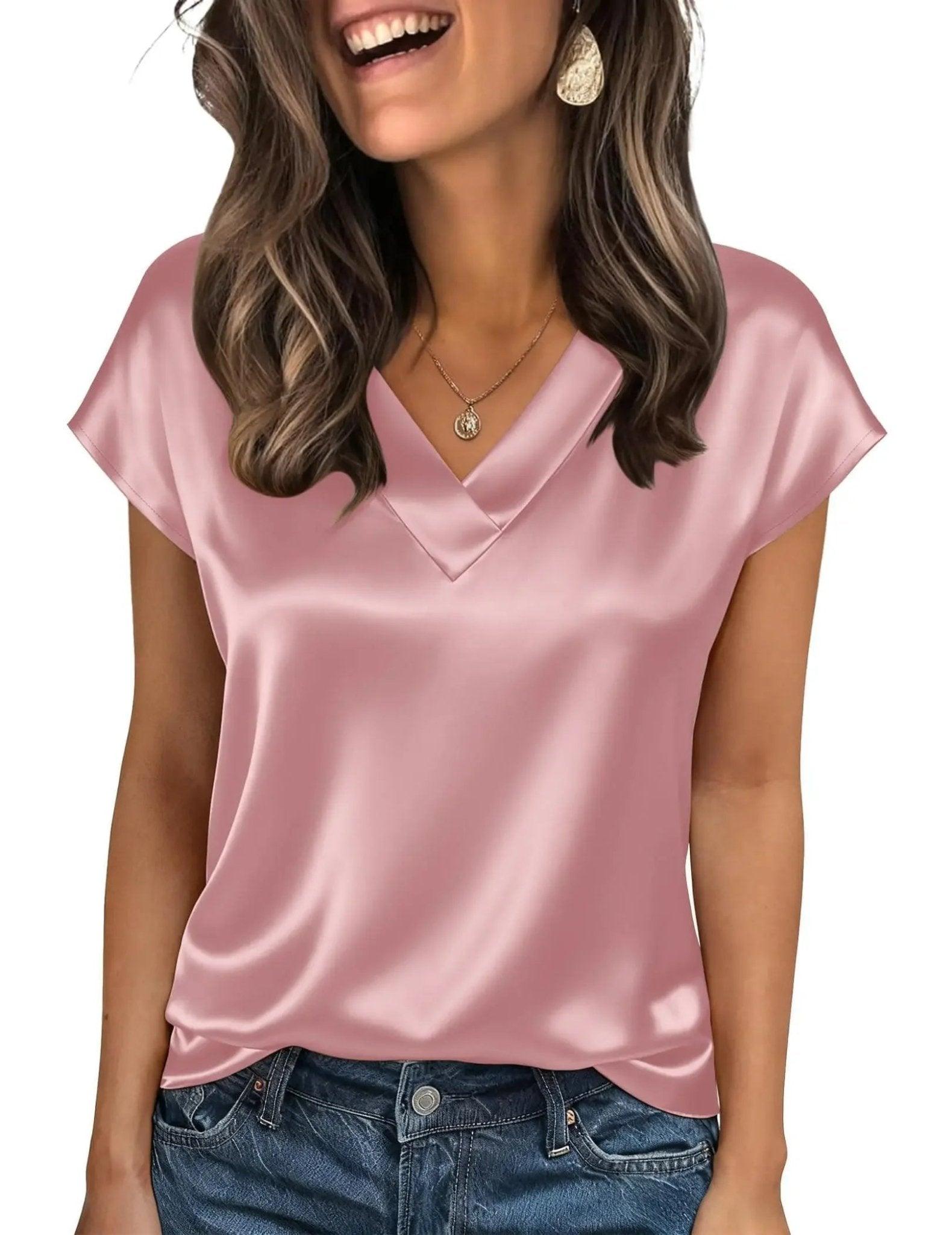 Pink satin V-neck women's top with short sleeves, styled with jeans and gold jewelry for casual fashion