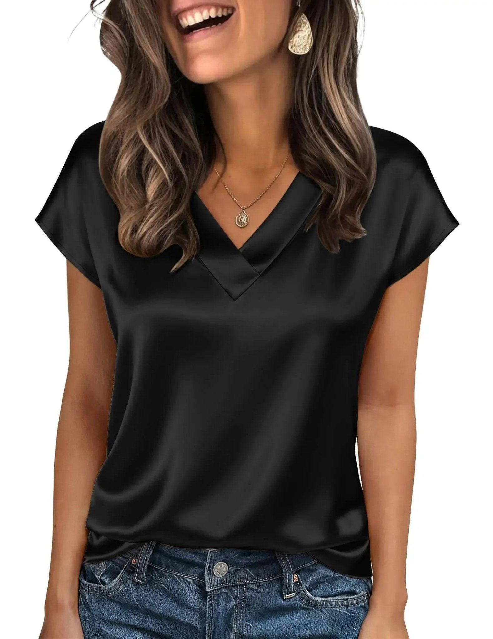 Black satin V-neck women's top with short sleeves, styled with jeans and gold jewelry for casual fashion.