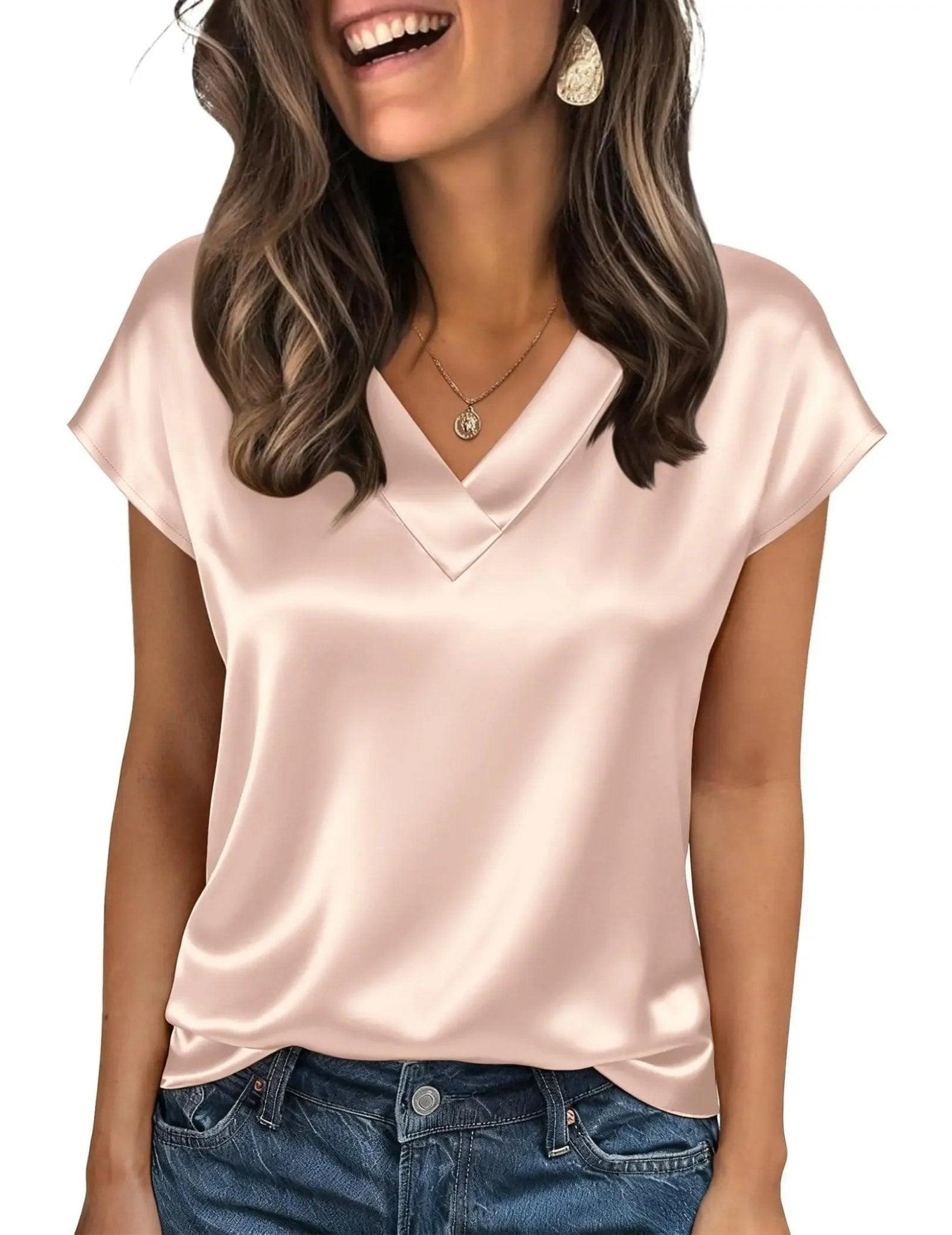 Blush pink satin V-neck women's top with short sleeves, paired with jeans for casual fashion
