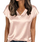 Pink satin V-neck women's blouse with short sleeves, paired with jeans for casual fashion