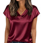 Burgundy satin V-neck women's top with short sleeves, paired with jeans for casual fashion