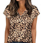 Woman wearing leopard print V-neck top with short sleeves, paired with jeans, for casual fashion style