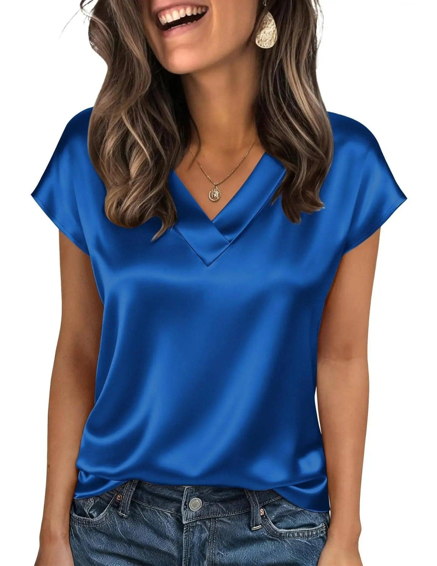 Blue satin V-neck women's top with short sleeves, paired with jeans and gold jewelry
