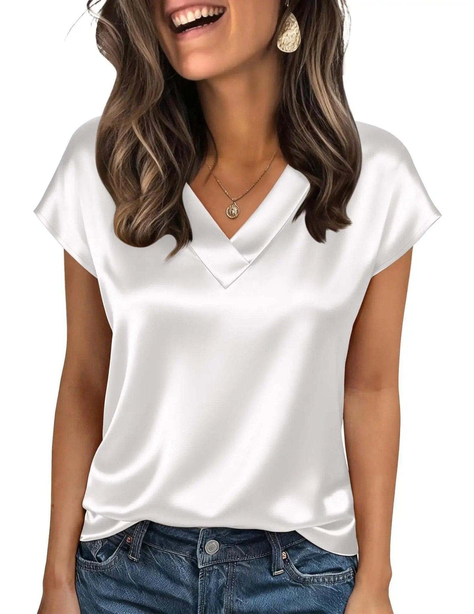 White V-neck satin blouse for women, paired with jeans and gold jewelry, perfect for casual fashion.