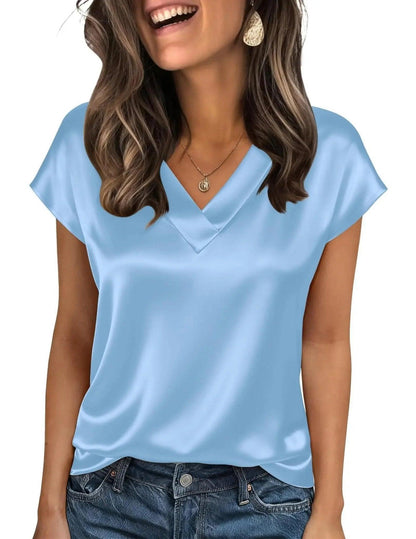 Light blue satin V-neck women's top with short sleeves, paired with denim jeans for casual fashion
