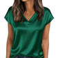 Emerald green satin V-neck women's top with short sleeves, paired with jeans for casual fashion