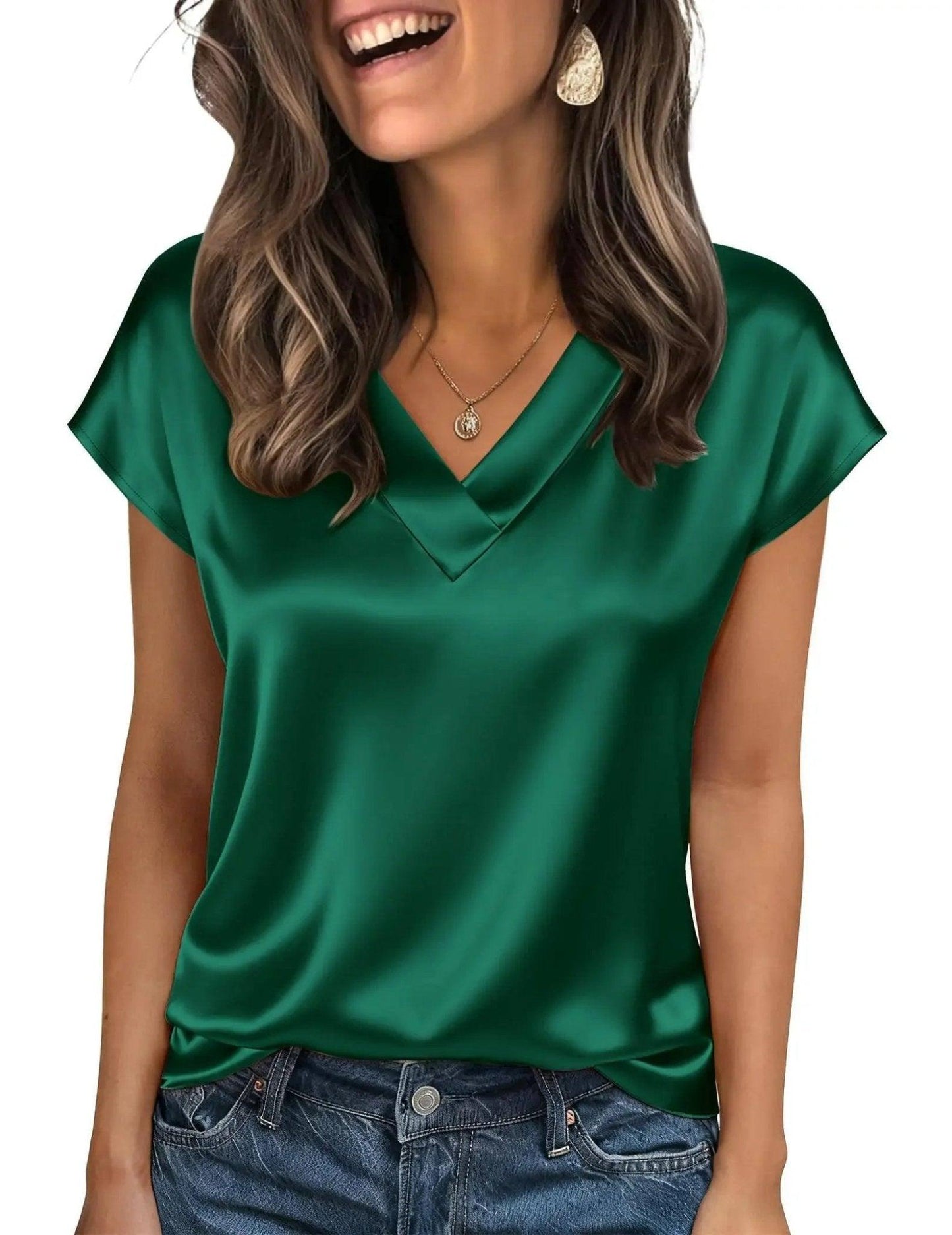 Emerald green satin V-neck women's top with short sleeves, paired with jeans for casual fashion