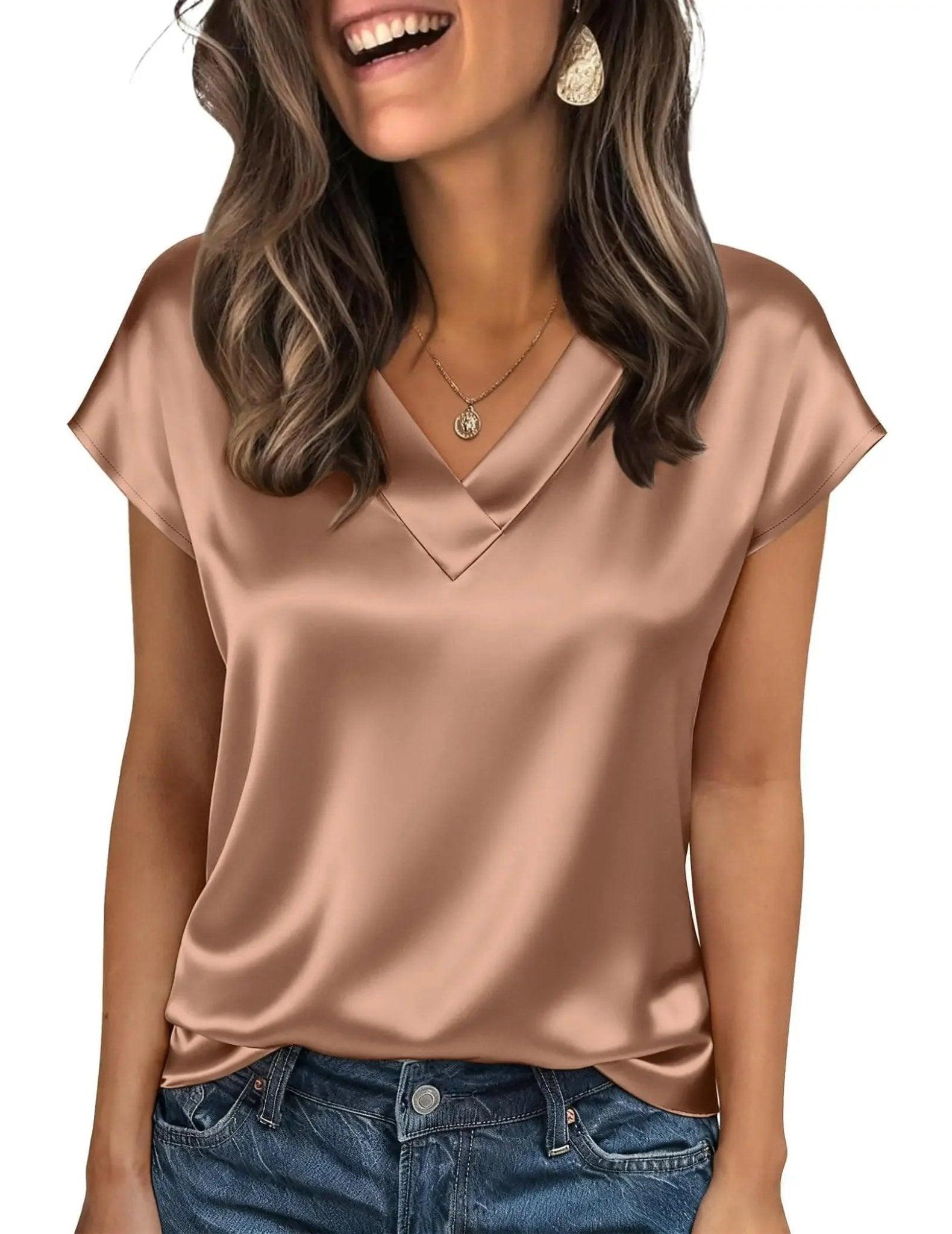 Woman wearing elegant satin V-neck top with short sleeves, paired with jeans, perfect for casual fashion