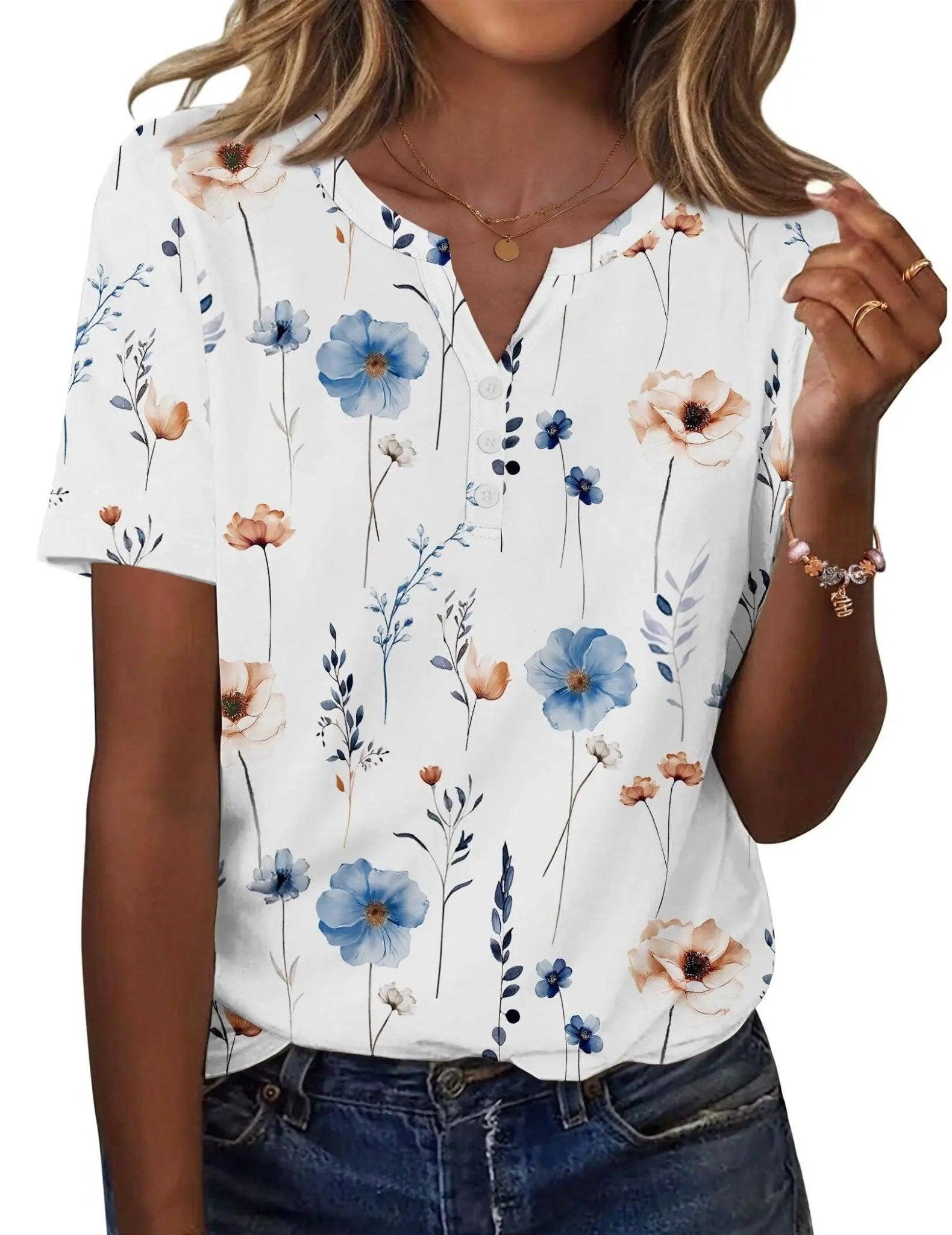 Women's floral print V-neck blouse with blue and peach flowers, short sleeves, button front, paired with jeans