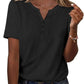 Black women's V-neck button-up t-shirt with short sleeves, paired with denim jeans and gold jewelry.