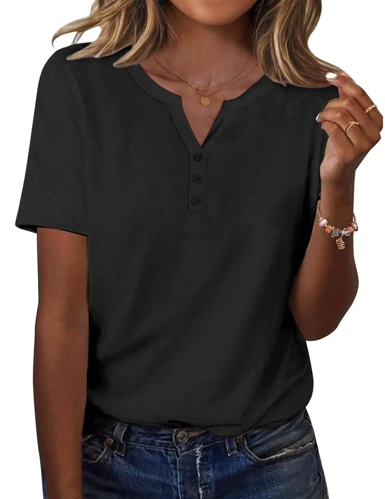 Black women's V-neck button-up t-shirt with short sleeves, paired with denim jeans and gold jewelry.
