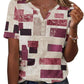 Woman wearing geometric print V-neck button-up top with short sleeves, paired with denim jeans for casual fashion.