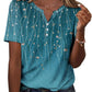 Teal floral print women's V-neck button-up top with short sleeves, paired with jeans for casual fashion