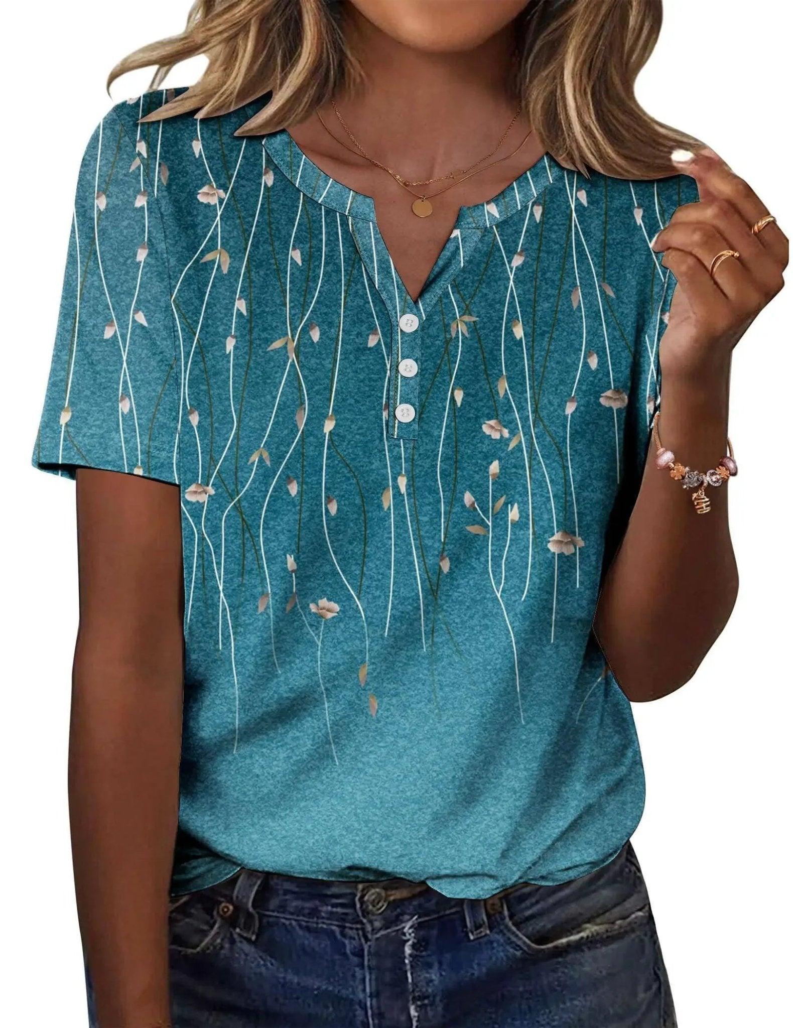 Teal floral print women's V-neck button-up top with short sleeves, paired with jeans for casual fashion