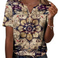 Woman wearing boho floral print V-neck button-up top with short sleeves, paired with jeans