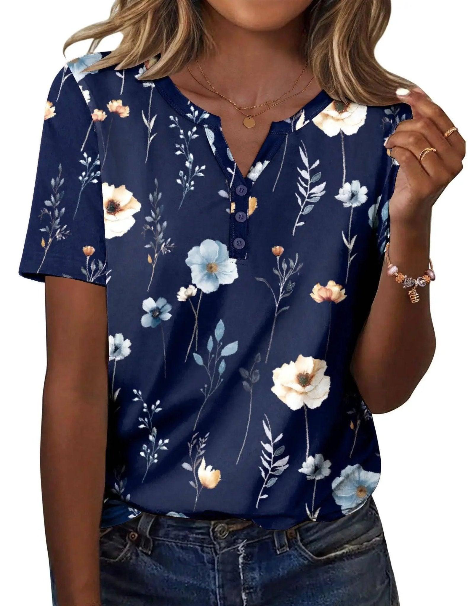 Navy blue floral print women's V-neck button-up top with short sleeves, paired with denim jeans