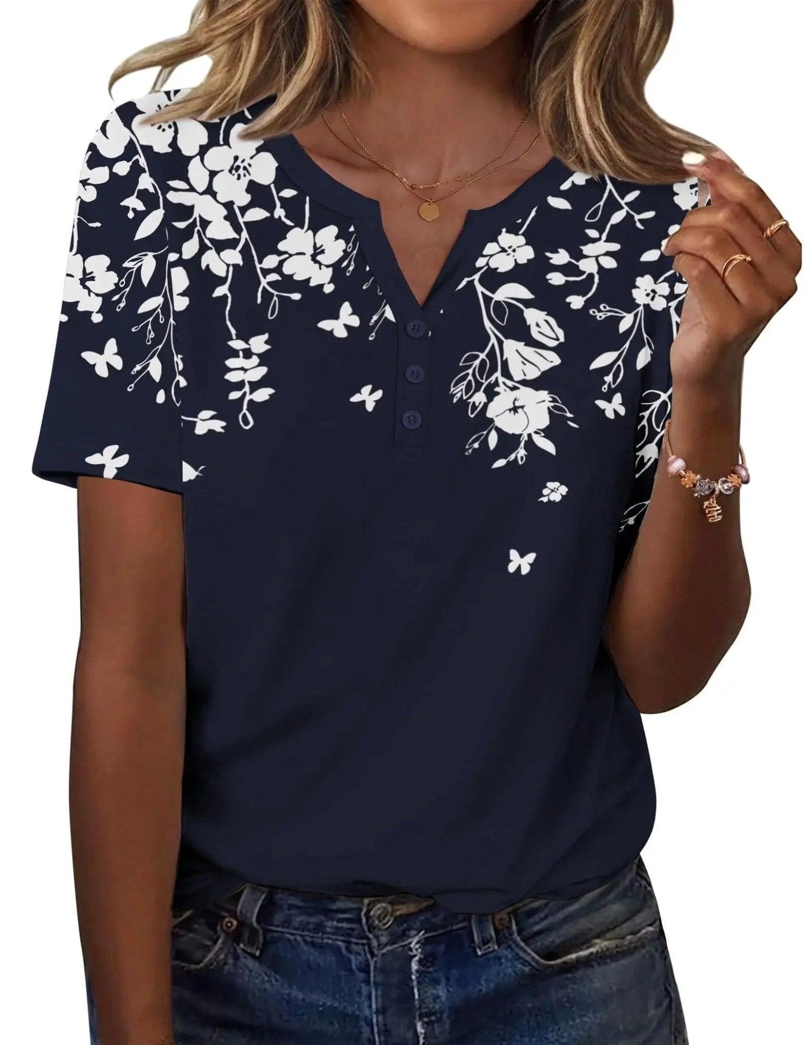Navy blue women's floral print V-neck short sleeve top with button detail, paired with jeans